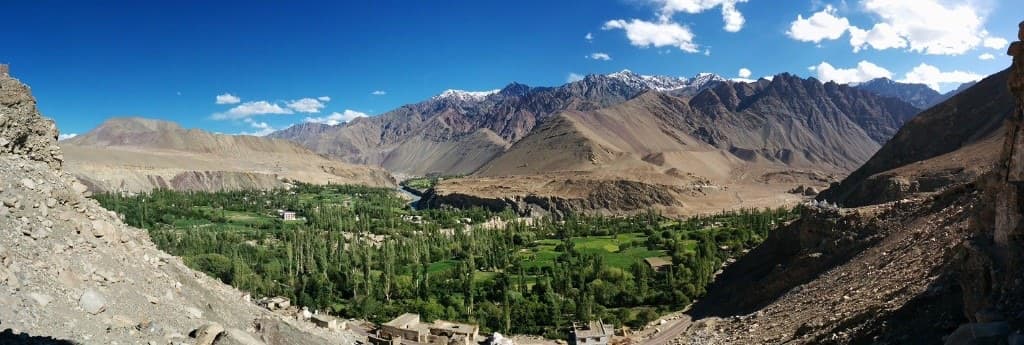 Green valley between arid mountains in Ladakh